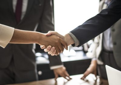 Handshake between two successful business people in the office